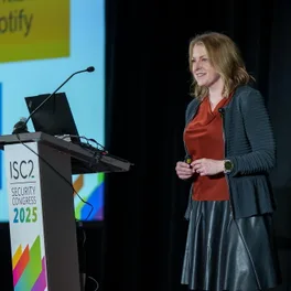 Lora Vaughn speaking on stage